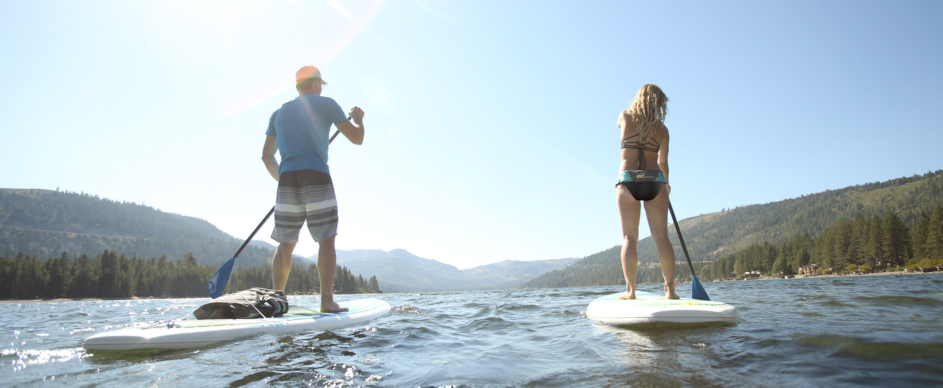 Picture of two people on stand up paddleboards