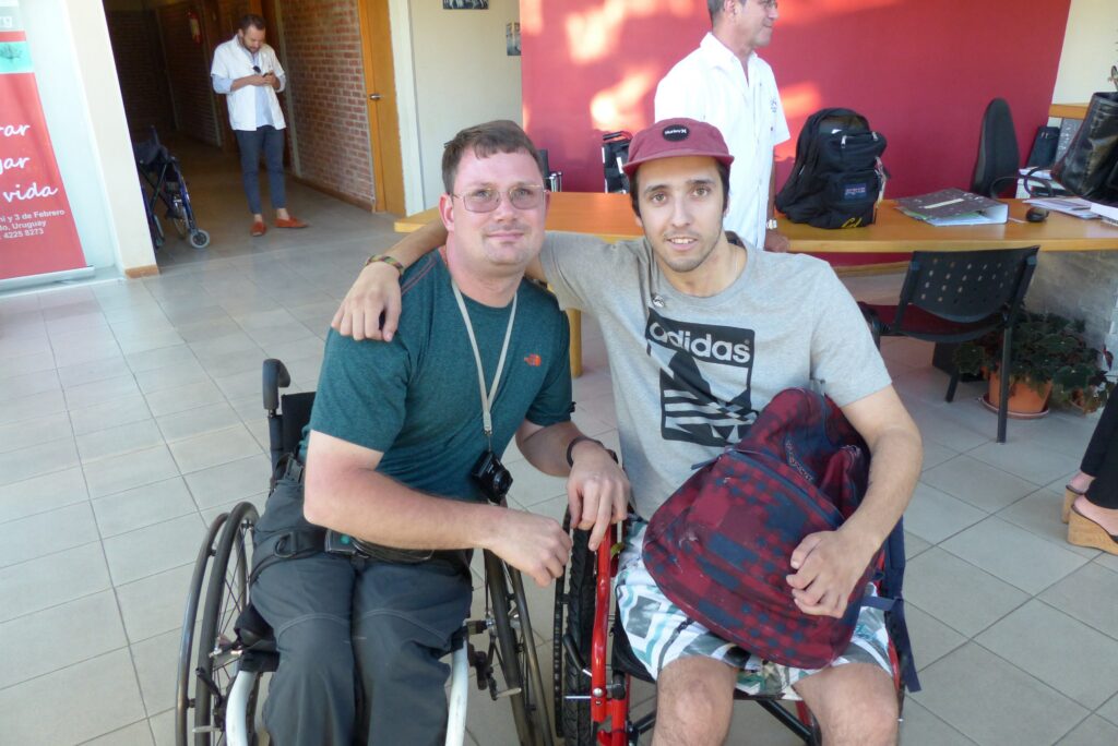 Josh and a young man paralyzed in a cliff-diving accident in Montevideo, Uruguay share a special moment together in 2016.
