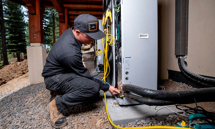 Inmotion Mechanical employee working on wiring