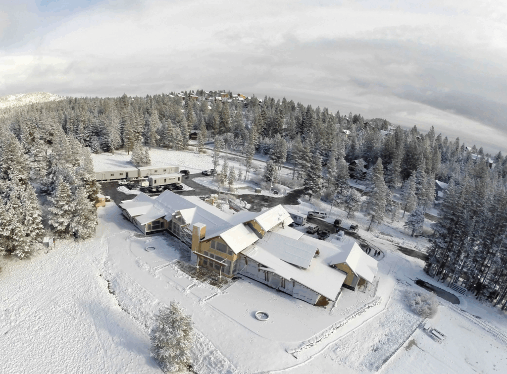 Top: The demolition of the old Cross Country Ski Center in June 2014. Bottom: An aerial view of the Cross Country Ski Center temporary operations and construction of the Alder Creek Adventure Center in December 2014. Photos from the Tahoe Donner archive.